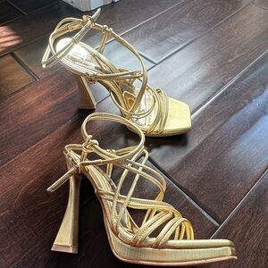 Jennifer Lopez Gold Strappy Heels for Special Occasions